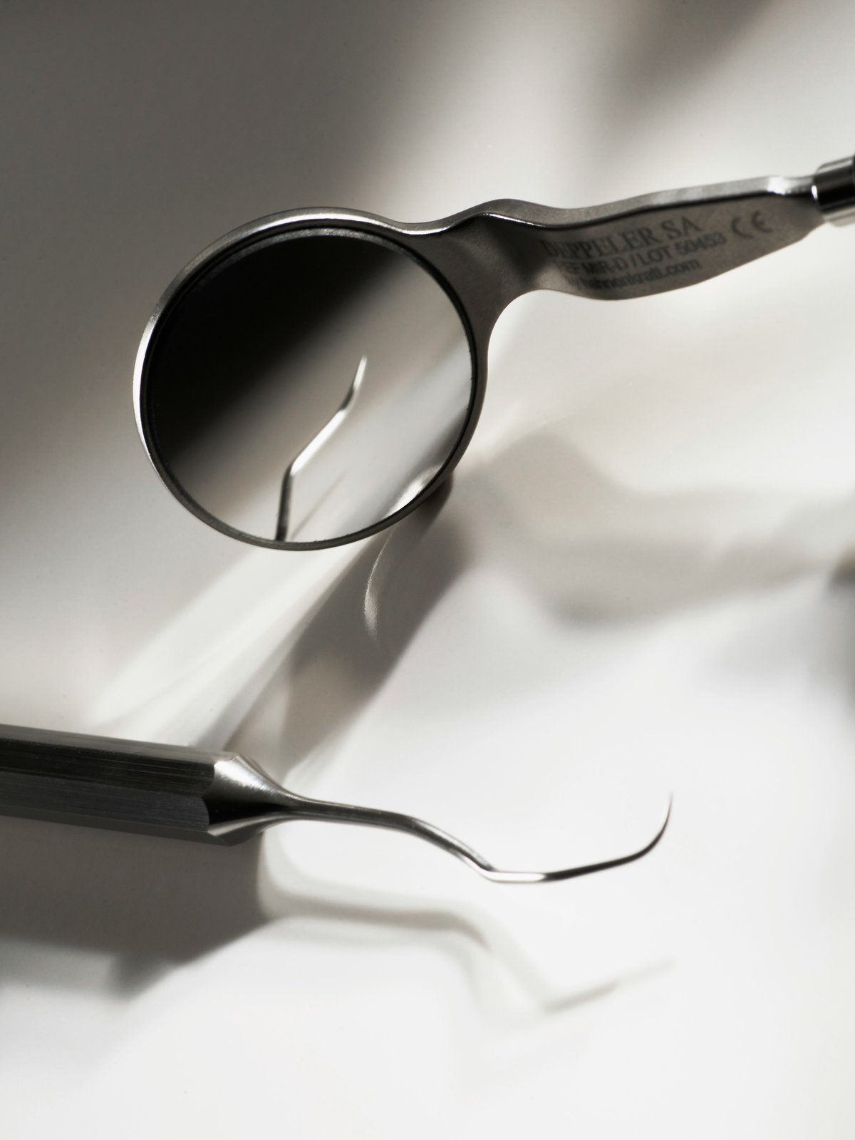 Dental mirror and scaler — precision specialist work, W1 Marylebone